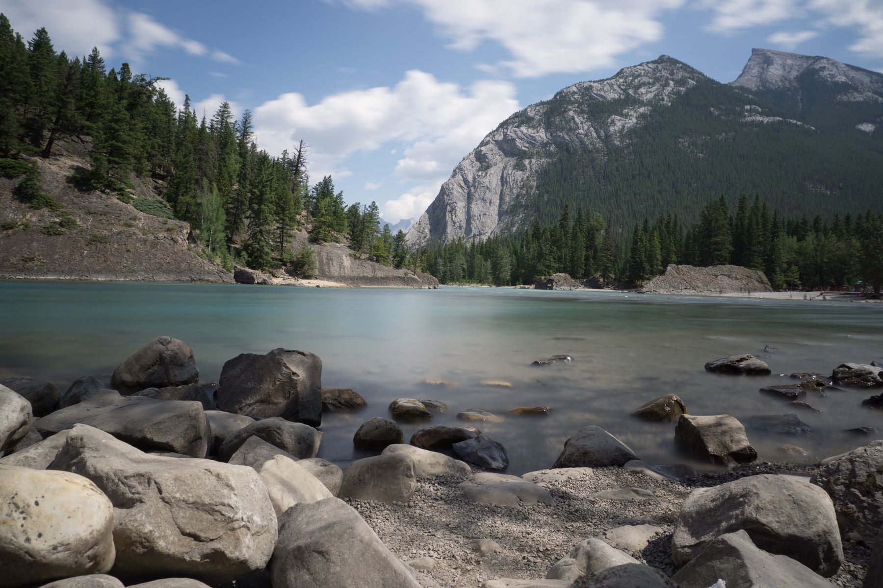 A Canadian mountain lake surrounded by evergreen forest